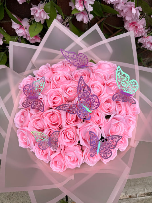 Pink and white forever rose bouquet with decorative butterflies